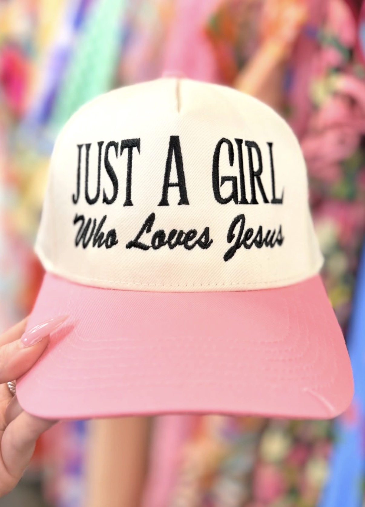 Pink Jessalynn Boutique hat with boutique clothing in the background